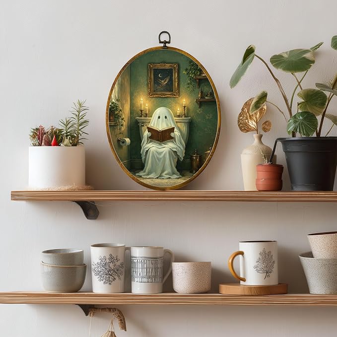 Reading Ghost Oval Wall Art, Framed Canvas Decor, 8.5x11.5 Inch | Reading ghost in vintage bathroom, candlelight, gothic cottagecore Halloween decor