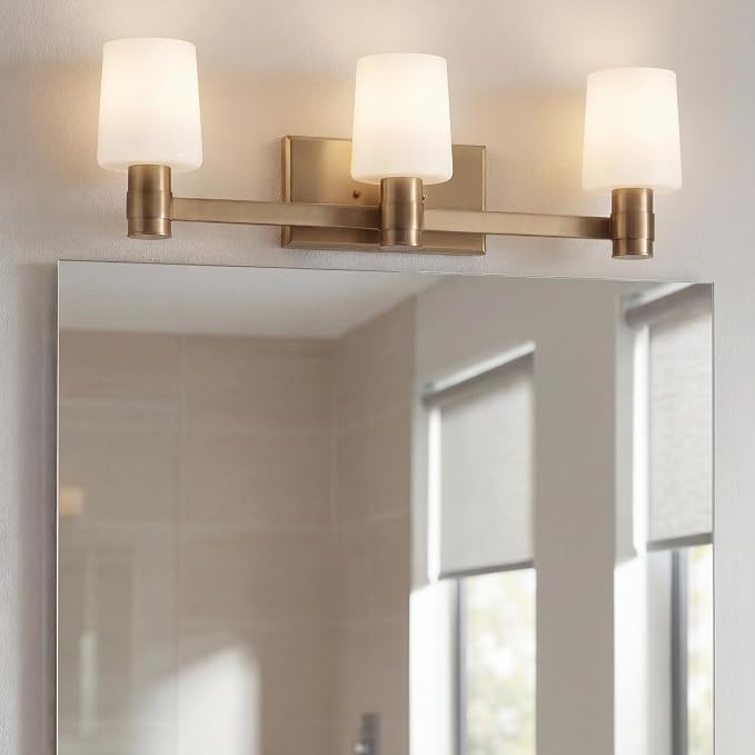 Kichler Adani 3-Light Bathroom Vanity Light, Champagne Bronze | Modern vanity light with opal glass for bathrooms and powder rooms (24" x 8.25"), 55176CPZ