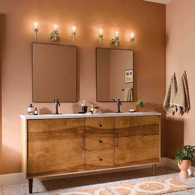 Kichler Madden 3-Light Bathroom Vanity Light, Champagne Bronze | Modern vanity light with clear glass for single bathroom mirrors (24" x 10.5"), 55185CPZ