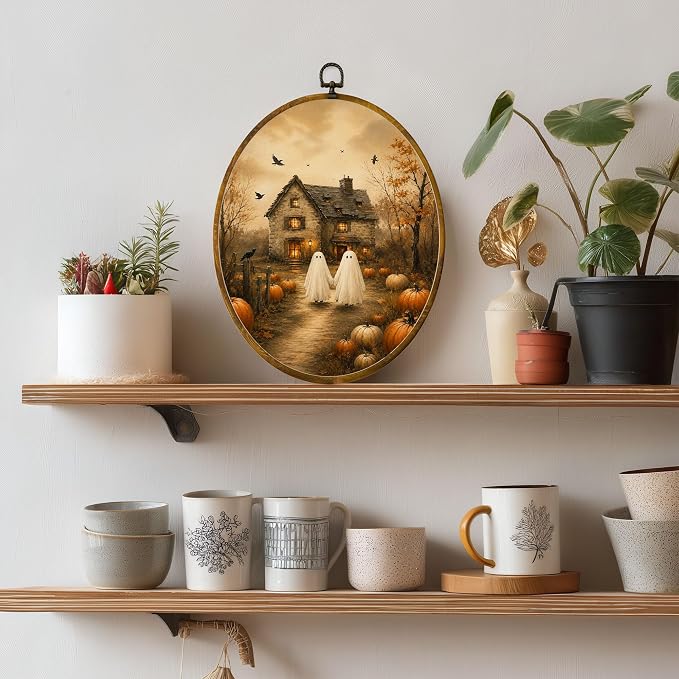 Ghost Cottage Oval Wall Art, Framed Canvas Decor, 8.5x11.5 Inch | Two ghosts walking to a pumpkin cottage, autumn trees and crows Halloween decor