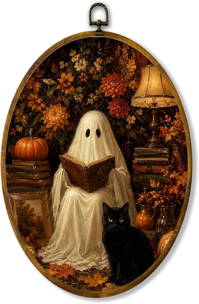 Reading Ghost Black Cat Oval Wall Art, Framed Canvas Decor, 8.5x11.5 Inch | Reading ghost with black cat, pumpkins, autumn flowers and cozy lamp decor